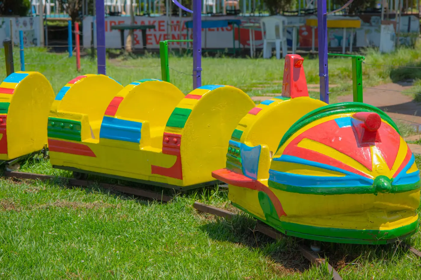 The brightly painted baby train carriages on their track at Vipe Fun Park