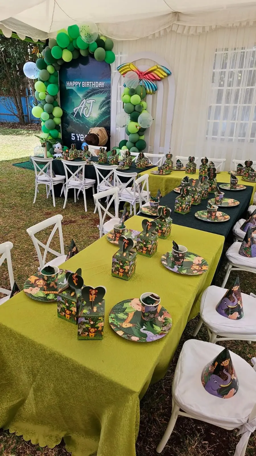 A jungle-themed birthday party with balloon columns, gift boxes and set tables at Vipe Fun Park