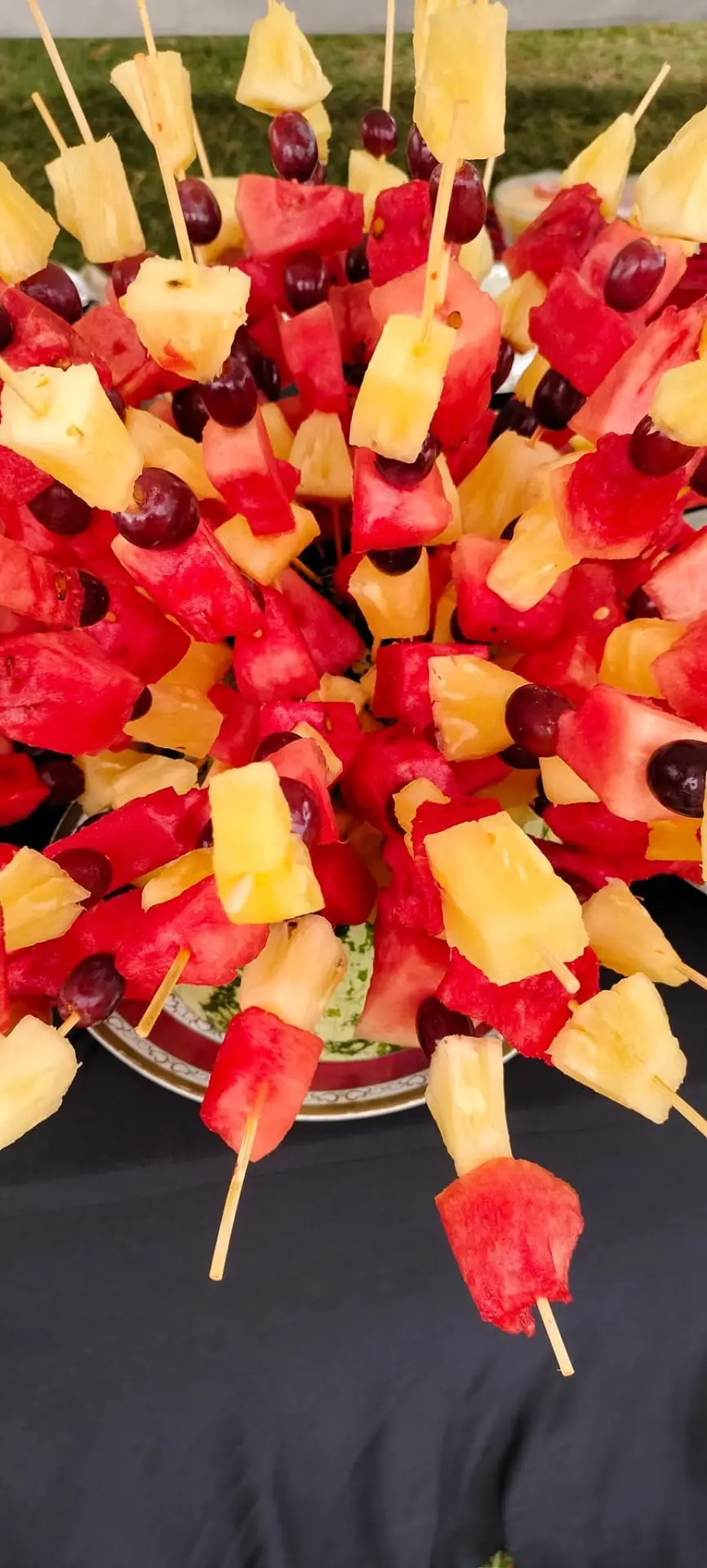 Watermelon, pineapple and grape skewers arranged on a serving tray at Vipe Fun Park