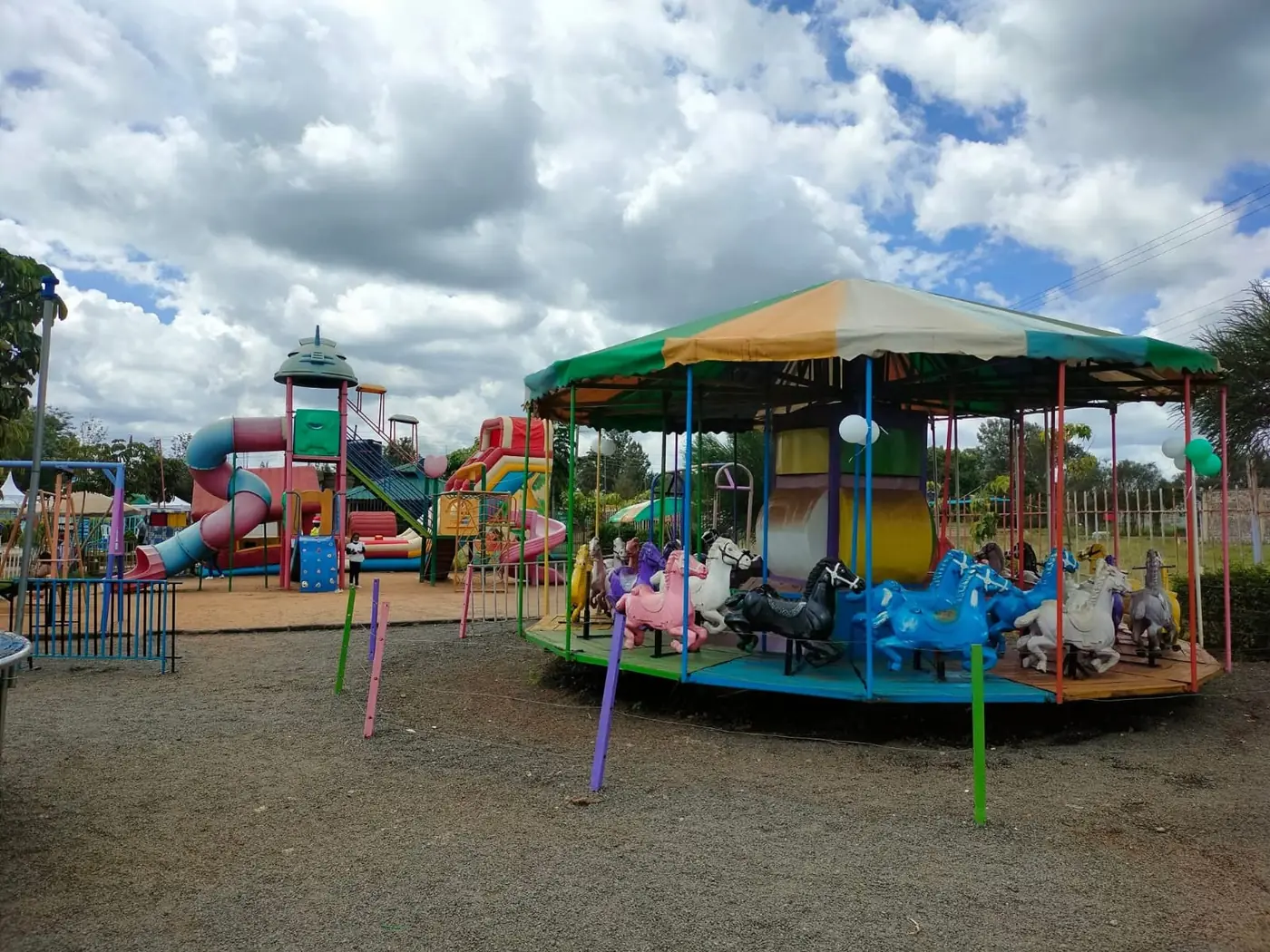 The merry-go-round beside the slides and playground structures at Vipe Fun Park