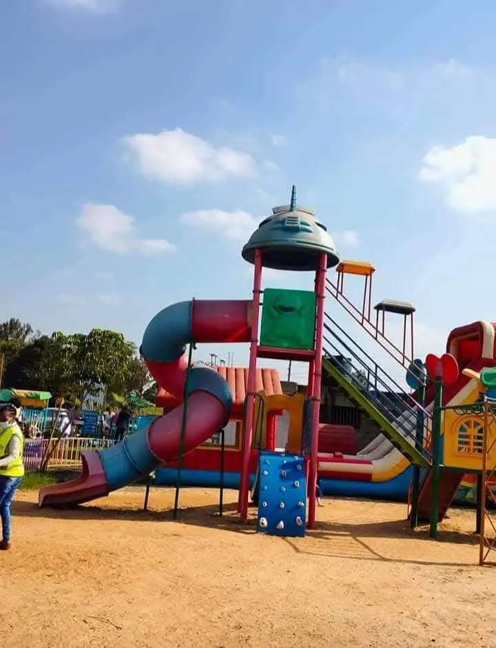 The playground tower with tube slide, climbing wall and stairs at Vipe Fun Park