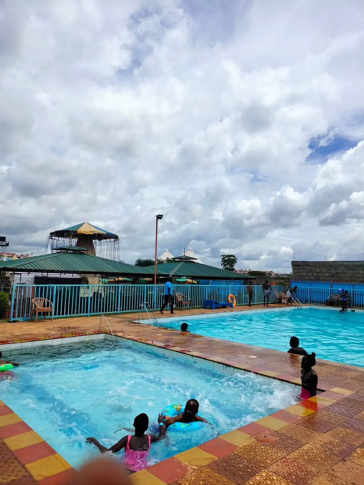 Visitors seen at a distance enjoying the swimming pools at Vipe Fun Park